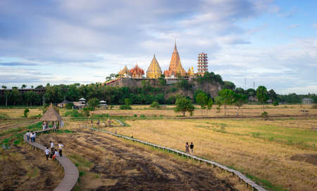 Kanchanaburi, Thailandâ -â  July 29, 2019â: Viewâ of greenâ fieldâ and Tigerâ caveâ temple (Wat Tham Sua)â from Meenaâ cafÃ© coffee shopのeditorial素材