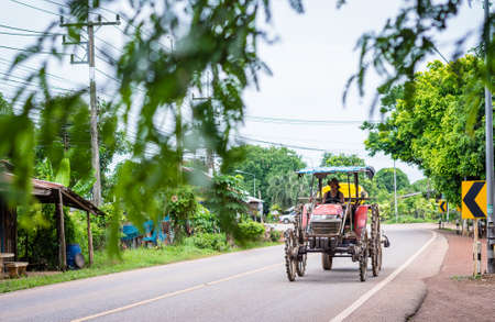 Prachinburi,Thailand - August 11, 2019 : People driving old car through a national road in...