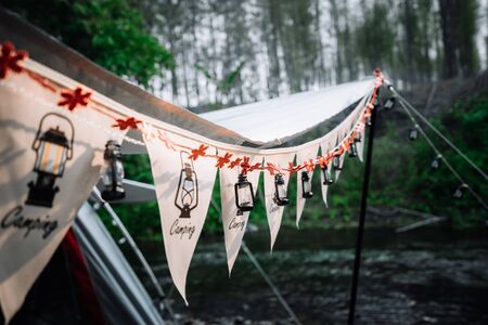 Vintage retro lamp and flag decoration at outdoor camping