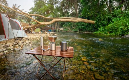 coffee drip while camping near the river in nature parkの写真素材