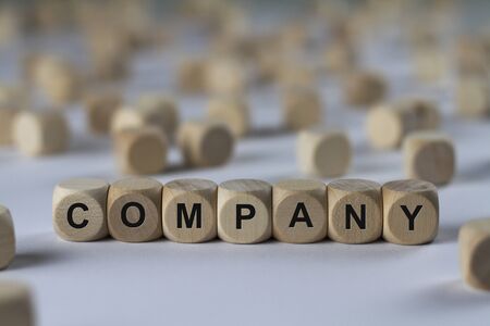 company - cube with letters, sign with wooden cubesの写真素材