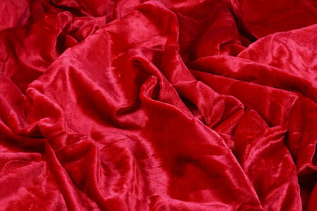 Red, soft velvet material folded pleatsの写真素材