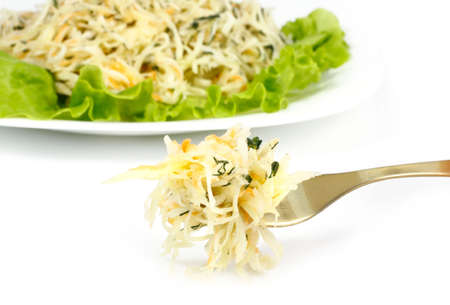 Cabbage cut into sticks and dressed with butter on a plateの写真素材