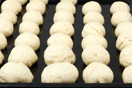 Harvesting of dough for bunsの写真素材