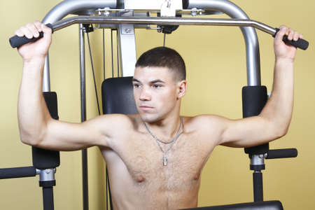 young guy doing on the treadmill exercise for muscle