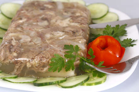 Jellied chicken decorated with cucumber and rose with tomatoの写真素材