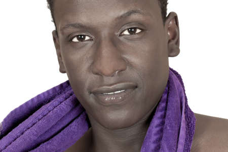 dark-skinned young man with a towel around his neck isolated on a white background