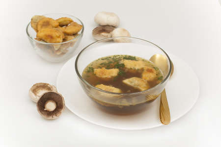 mushroom soup with roasted ears in a glass bowlの写真素材