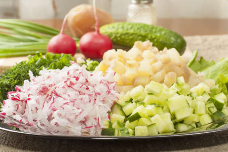 chopped raw vegetables for a variety of salads and okroshkaの写真素材
