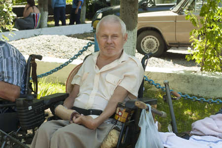 crippled asking for near the temple on the day of the Holy Trinity