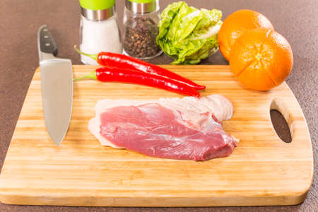 duck breast fillet on a cutting boardの写真素材