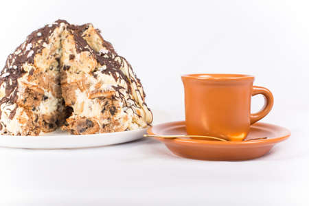 majolica coffee Cup on the background of the cut cakeの写真素材