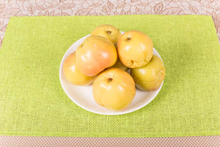 pickled apples on the plate closeupの写真素材