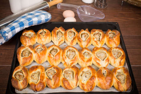 Pie snack from yeast-fermented sponge dough with fish stuffingの写真素材