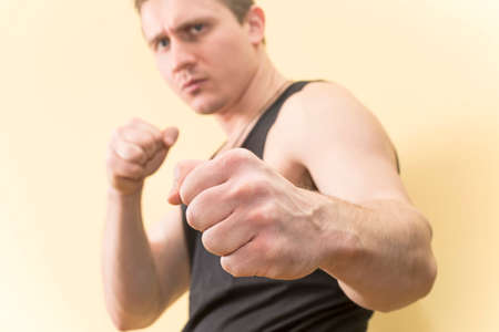young man dressed in a Boxing stanceの写真素材