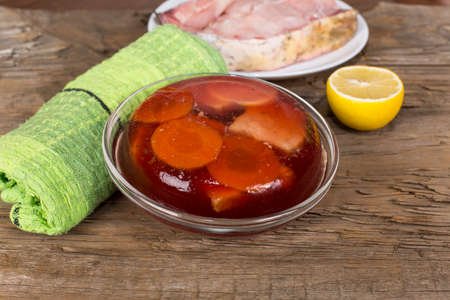 the jellied fish on the table of the old rotten boards
