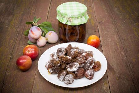 plum fresh, dried drenched in syrupの写真素材
