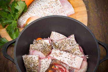 fish bream cut into pieces and folded into the cauldronの写真素材