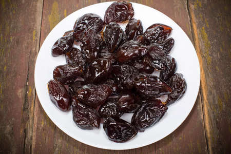 dried plum candied with sugar powderの写真素材
