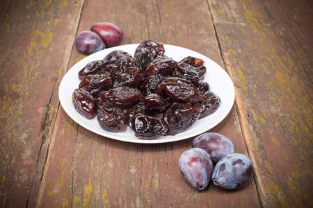 dried plum candied with sugar powderの写真素材