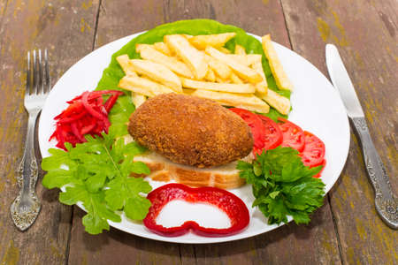 chicken fish Ukraine on the croutons with grilled friesの写真素材
