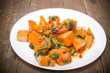 slices of pumpkin roasted with hot spicesの写真素材