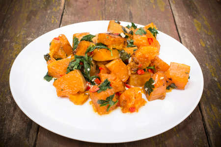 slices of pumpkin roasted with hot spicesの写真素材