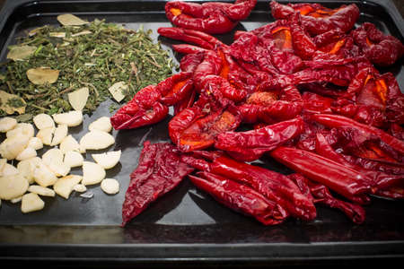 dried pepper with dried herbs and garlicの写真素材