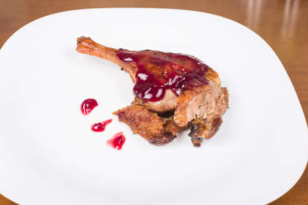 roasted duck leg with raspberry sauceの写真素材
