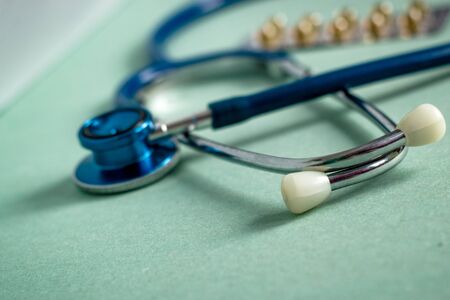 A stethoscope on a textured background, blur