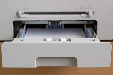 open the tray of the copier with paperの写真素材