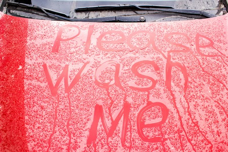the inscription on a dirty car, wash meの写真素材