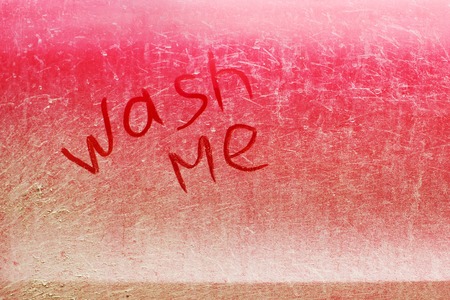 the inscription on a dirty car, wash meの写真素材