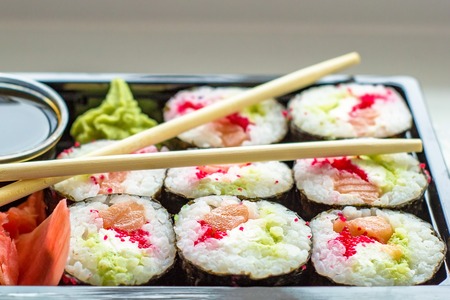 The image plate of sushi with soy sauce, wasabi and chopsticksの写真素材