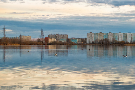 evening city at the waters edge at sunsetの写真素材