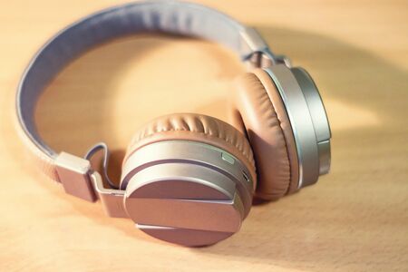The image Bluetooth headphone on wooden backgroundの写真素材
