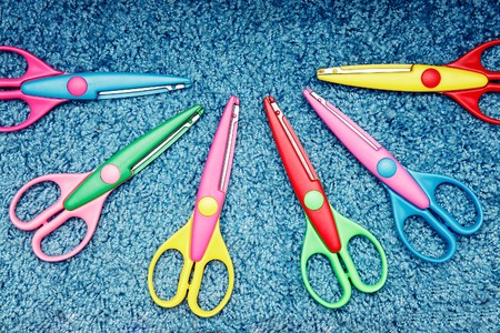 scissors for children paper on the background of the carpetの写真素材