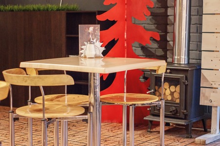 The image table and chairs in the cosy restaurant
