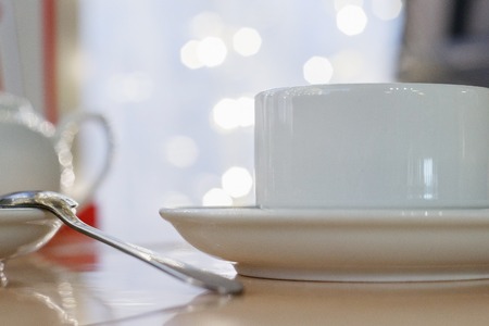 The image white Cup on table in cafeの写真素材