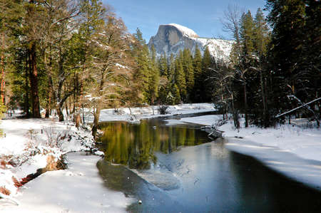 Yosemite with half dome covered in snowの写真素材