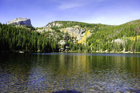 Fall colors reflecting in the waters of Bear Lake, Rocky mountain national parkの写真素材