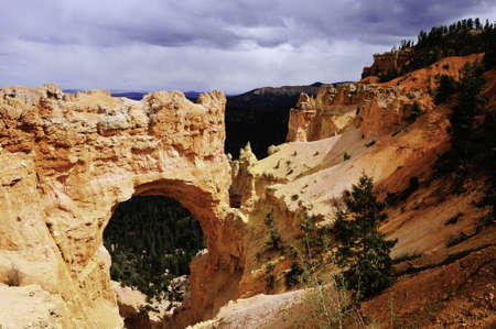 Natural bridge with dark sky at Bryce Canyon National Parkの写真素材