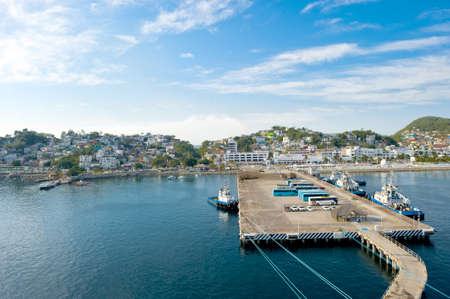 The cruise ship port at Manzanillo, mexico with the city in the backgroundのeditorial素材