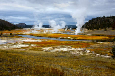 Hot springs along a river in Yellowstone National Parkの写真素材