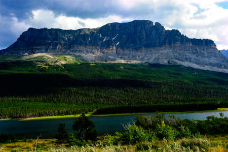 Mountain scene with river at Glacier National Park, Montanaの写真素材