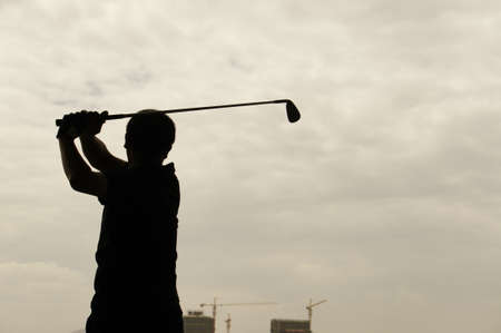 Man playing golfの写真素材