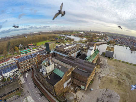 Industrial factory with pigeonsの写真素材