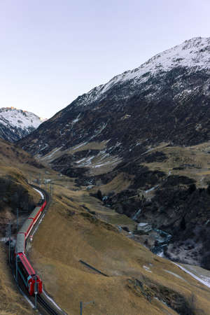 Train driving through the Alpsの写真素材