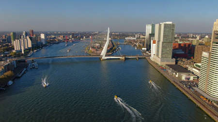 The Maas in Rotterdam with erasmus bridge and water taxisの写真素材