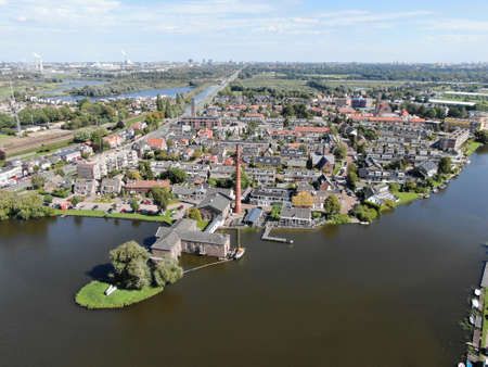 Aerial of historic steam pump station with pipe in Halfweg, the Netherlandsの写真素材